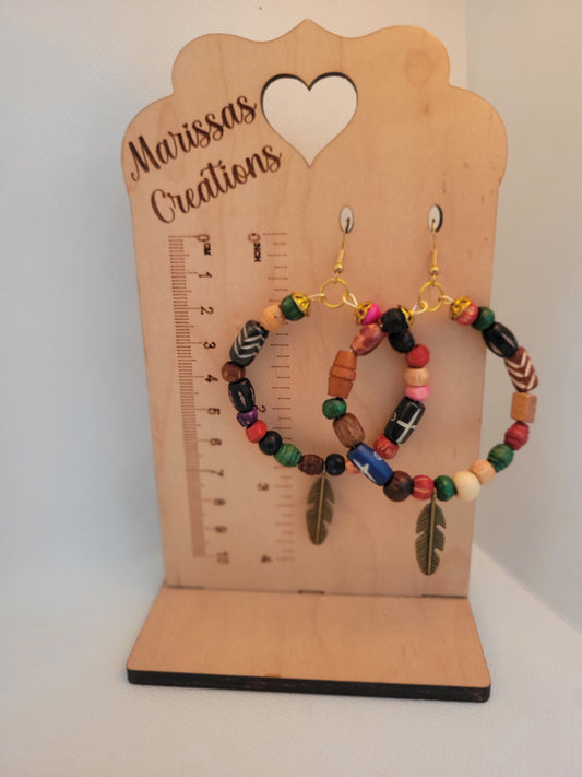 Feather charm with wood beads